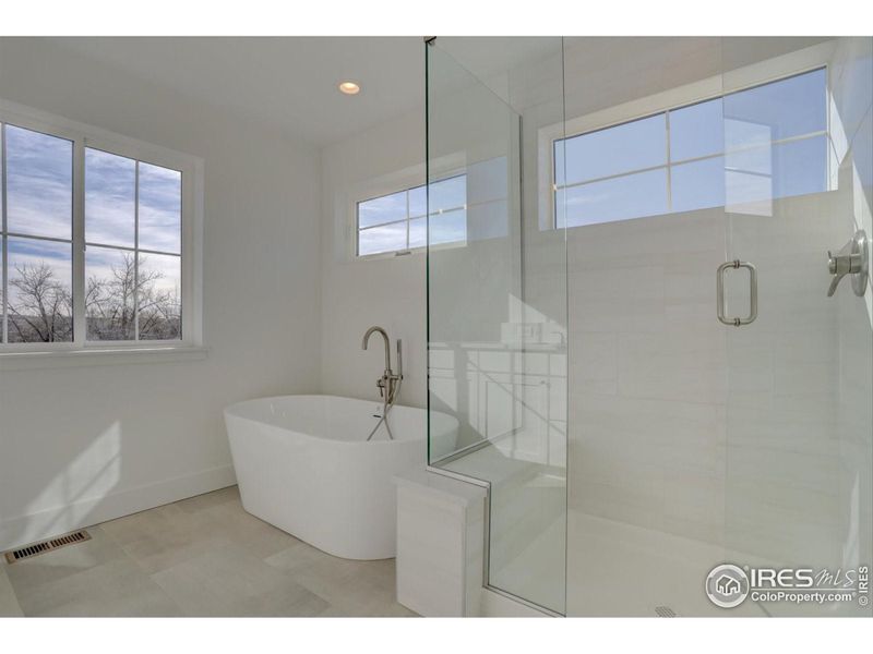 Main Bath - Not of this home but similar plan and level of finishes.