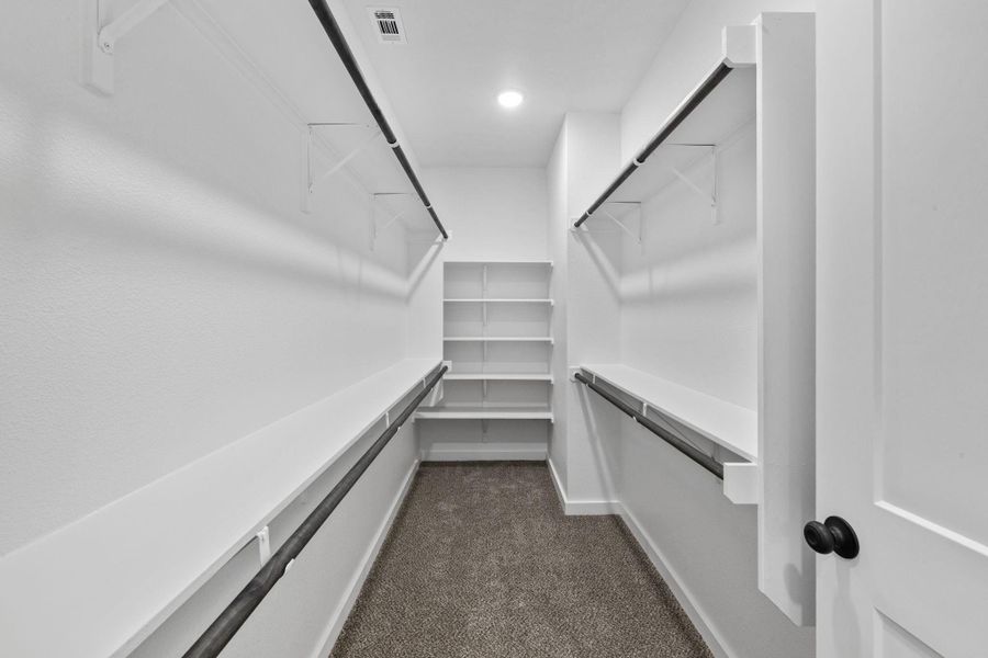 Ample shelving and hanging space defines this well-appointed closet. Ample shelving and hanging space defines this well-appointed closet.