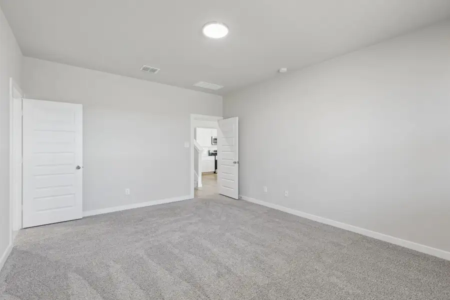 Primary Suite in the Holden home plan by Trophy Signature Homes – REPRESENTATIVE PHOTO