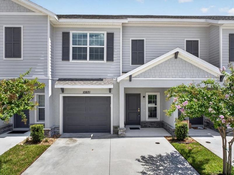 Front exterior of a new home in Calusa Creek, Riverview, FL, highlighting curb appeal (Image 21).