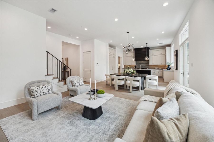 The stunning first floor was designed with relaxation and entertaining in mind! Spacious enough for ample seating surrounding the fireplace, a large dining table, and an island with additional seating that overlooks the living space. Additionally, elevator shaft is off of the living room for future elevator installation, but can be used as large storage closet. The stunning first floor was designed with relaxation and entertaining in mind! Spacious enough for ample seating surrounding the fireplace, a large dining table, and an island with additional seating that overlooks the living space. Additionally, elevator shaft is off of the living room for future elevator installation, but can be used as large storage closet.