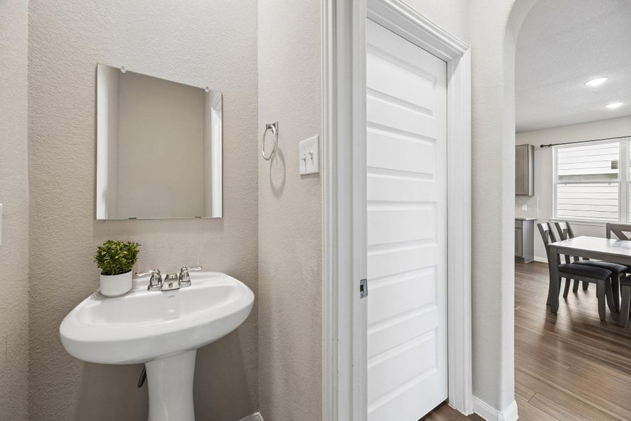 Downstairs half bath with laundry room adjacent Downstairs half bath with laundry room adjacent