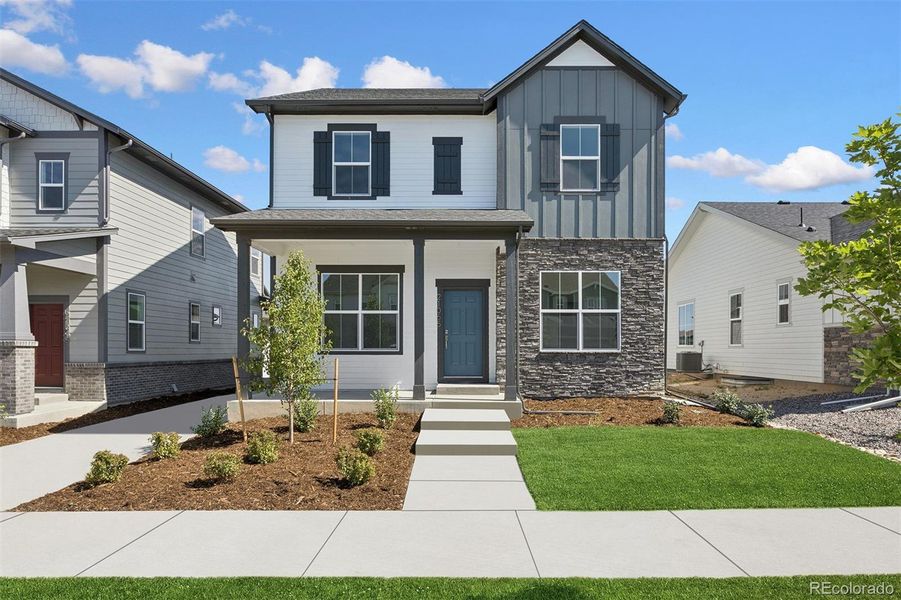 Front exterior of a new home in Painted Prairie Cottage, Aurora, CO, highlighting curb appeal (Image 28).