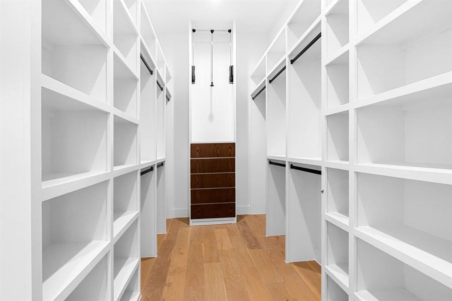 Large walk in closet with built ins