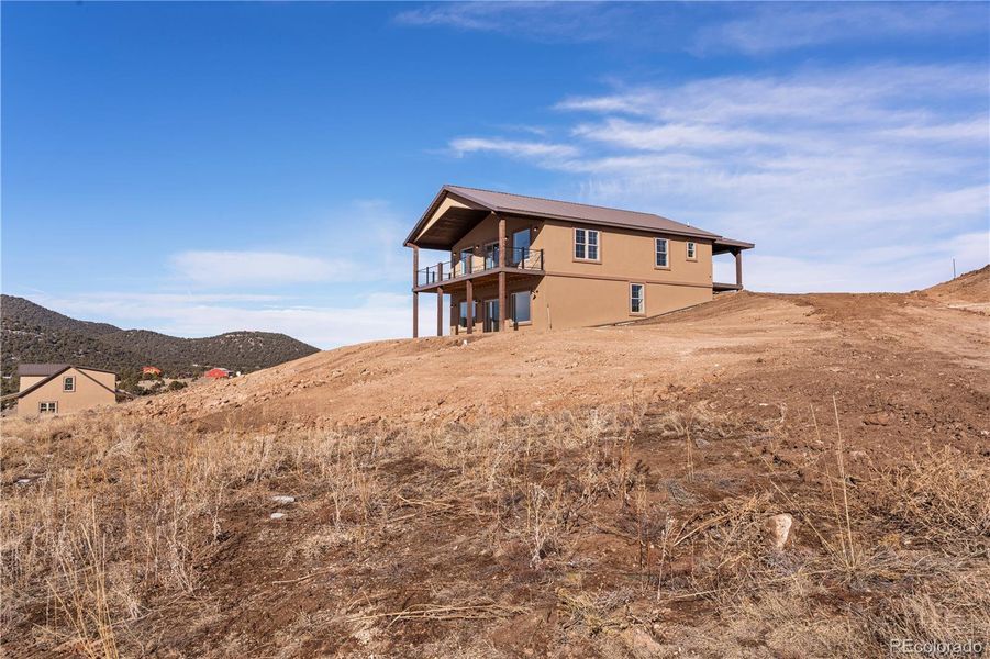 Front exterior of a new home in , Westcliffe, CO, highlighting curb appeal (Image 1). Front exterior of a new home in , Westcliffe, CO, highlighting curb appeal (Image 1).