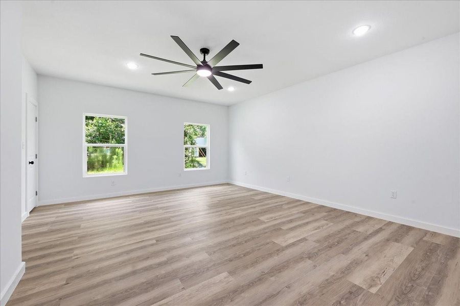 View showing the expansive layout and window placement of the additional bedroom space. View showing the expansive layout and window placement of the additional bedroom space.