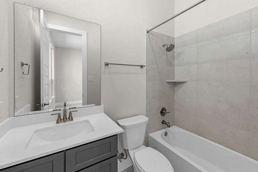 Furnished interior view inside a new home in Bridgeland, Cypress (Image 32).