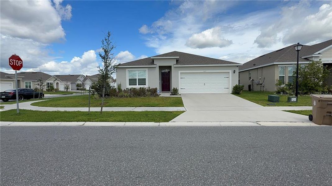 Front exterior of a new home in , Kissimmee, FL, highlighting curb appeal (Image 18).