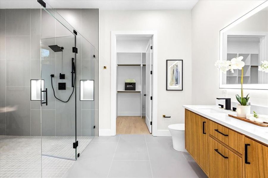 Bathroom with vanity, an enclosed shower, wood-type flooring, and toilet