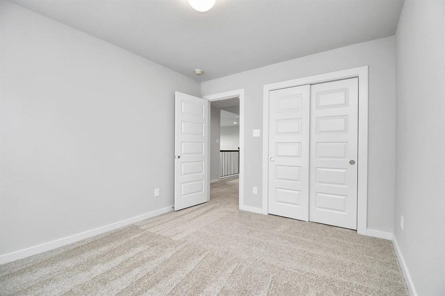 Generously sized secondary bedrooms, complete with spacious closets and soft, inviting carpeting.