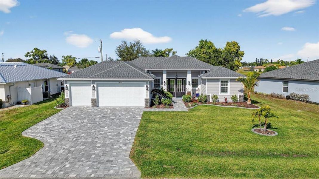 Front exterior of a new home in , Punta Gorda, FL, highlighting curb appeal (Image 21).
