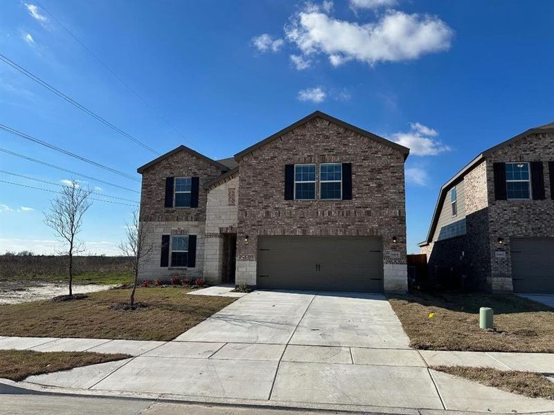 Front exterior of a new home in Verandah, Royse City, TX, highlighting curb appeal (Image 1). Front exterior of a new home in Verandah, Royse City, TX, highlighting curb appeal (Image 1).