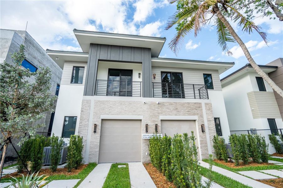 Front exterior of a new home in , Miami, FL, highlighting curb appeal (Image 1). Front exterior of a new home in , Miami, FL, highlighting curb appeal (Image 1).