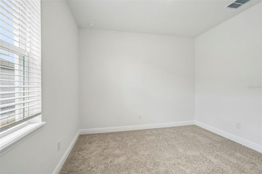 Spacious, unfurnished interior of a new home in Legends Preserve - Signature Series, Daytona Beach (Image 18).