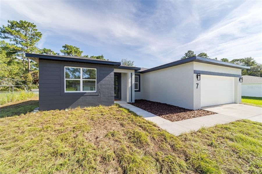 Front exterior of a new home in , Ocala, FL, highlighting curb appeal (Image 33).