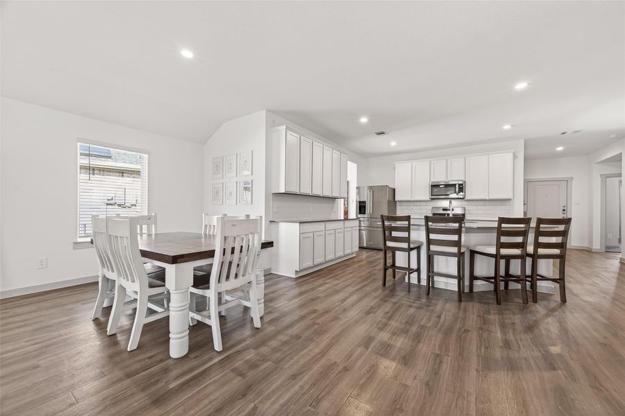 Dining area open to the kitchen and living area, recessed lighting continues. Dining area open to the kitchen and living area, recessed lighting continues.