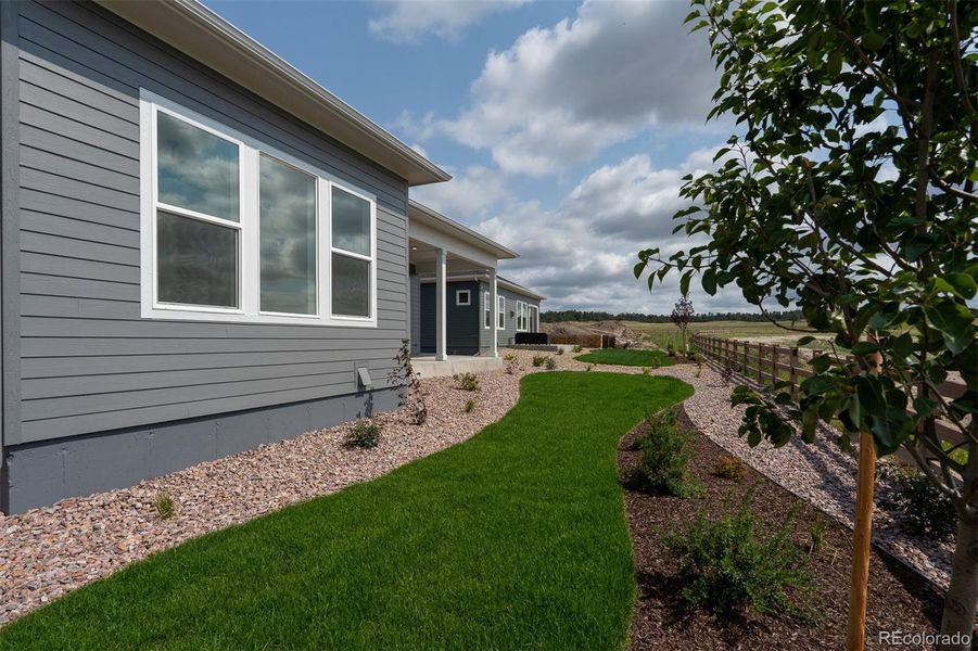 Front exterior of a new home in Wolf Ranch - Enclave Collection, Colorado Springs, CO, highlighting curb appeal (Image 24).