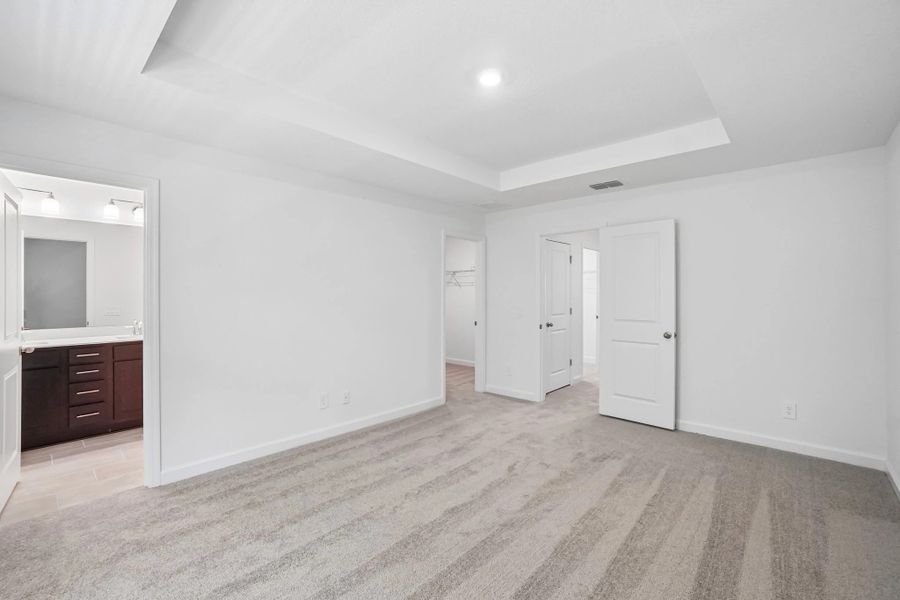 Primary bedroom features a separate bathroom and walk-in closet