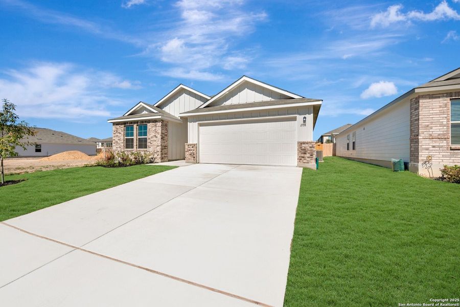 Front exterior of a new home in Greenspoint Heights, Seguin, TX, highlighting curb appeal (Image 20). Front exterior of a new home in Greenspoint Heights, Seguin, TX, highlighting curb appeal (Image 20).