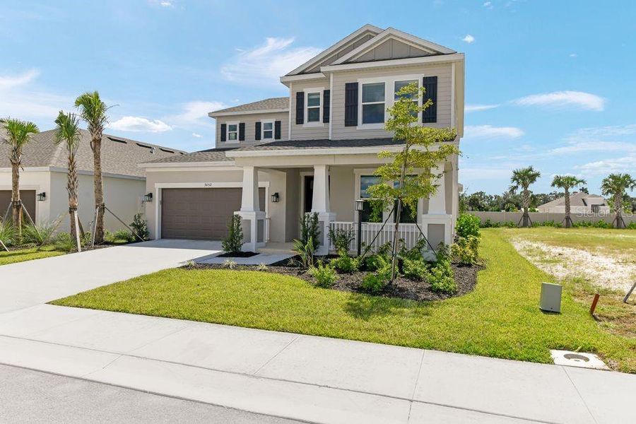 Front exterior of a new home in Tiburon, Nokomis, FL, highlighting curb appeal (Image 1). Front exterior of a new home in Tiburon, Nokomis, FL, highlighting curb appeal (Image 1).