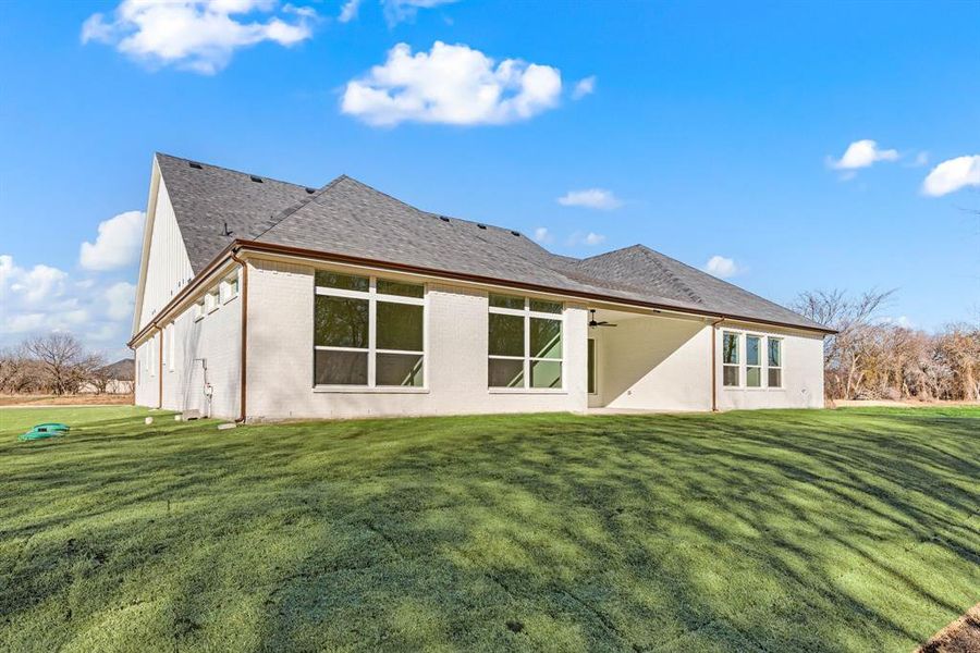 Front exterior of a new home in Rolling Creek Ranch, Aledo, TX, highlighting curb appeal (Image 21). Front exterior of a new home in Rolling Creek Ranch, Aledo, TX, highlighting curb appeal (Image 21).