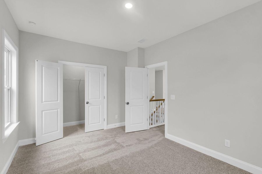 Spacious, unfurnished interior of a new home in Tidewater at Lakes of Cane Bay, Summerville (Image 34).