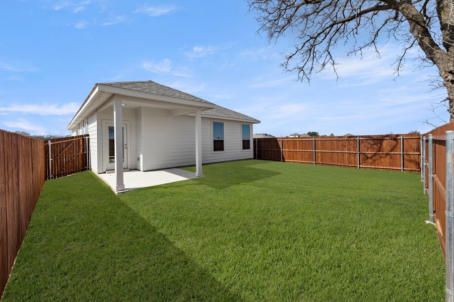 Front exterior of a new home in Belmont, Aubrey, TX, highlighting curb appeal (Image 27). Front exterior of a new home in Belmont, Aubrey, TX, highlighting curb appeal (Image 27).