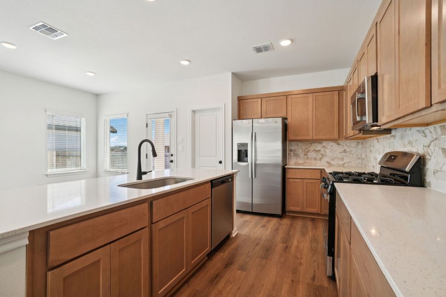 Furnished interior view inside a new home in Village at Three Oaks, Seguin (Image 6).