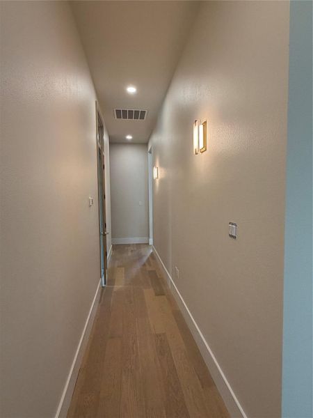 Hallway to laundry and main bedroom Hallway to laundry and main bedroom