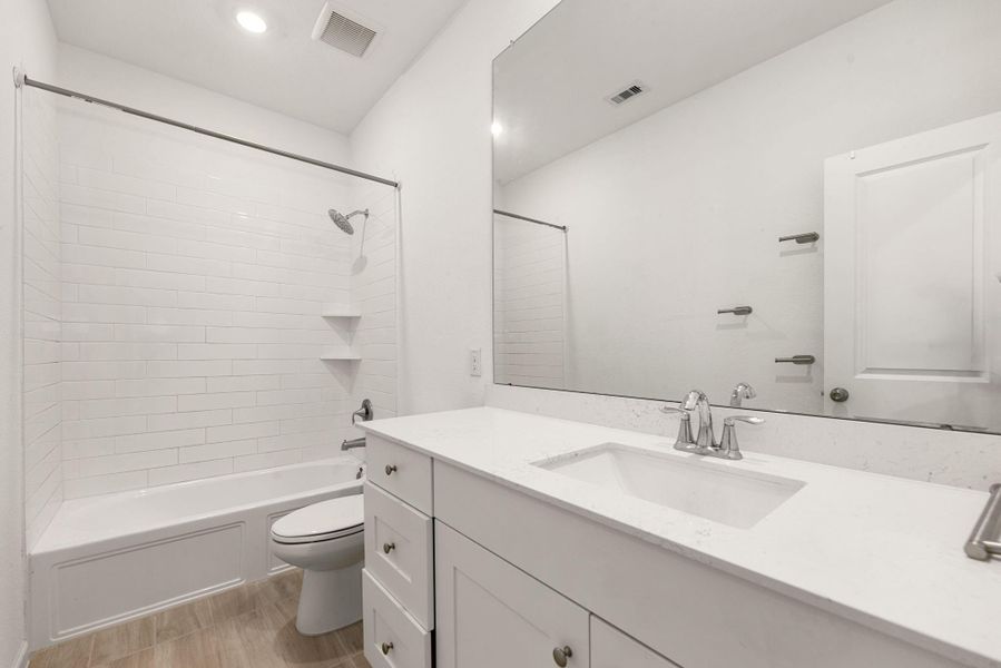 Furnished interior view inside a new home in Sunterra, Katy (Image 7).