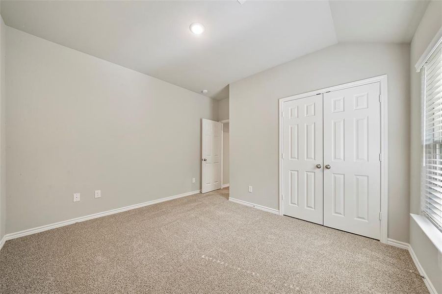 Guest bedroom #2 with double door closet