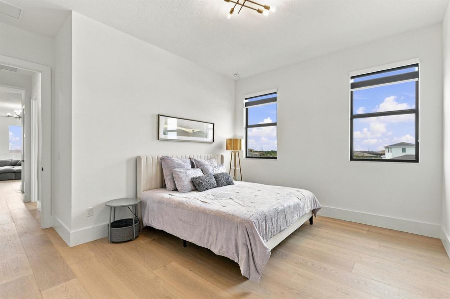 Bright Guest Bedroom with Dual Windows Bright Guest Bedroom with Dual Windows
