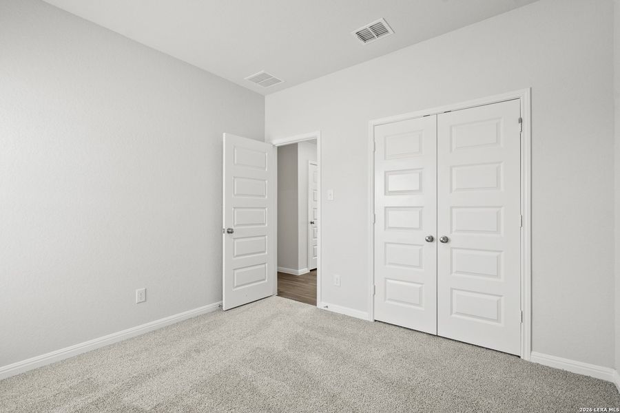 Spacious, unfurnished interior of a new home in Hunters Ranch, San Antonio (Image 13).