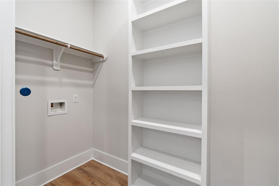 Thoughtfully designed utility room with built-in shelving, creating a more organized and efficient everyday routine. Thoughtfully designed utility room with built-in shelving, creating a more organized and efficient everyday routine.