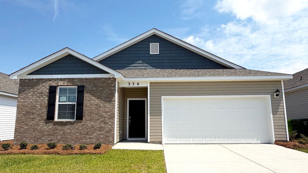 Front exterior of a new home in Hunter's Branch, Hopkins, SC, highlighting curb appeal (Image 1). Front exterior of a new home in Hunter's Branch, Hopkins, SC, highlighting curb appeal (Image 1).