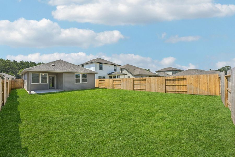Exterior details and patio area of a home in Landing Meadows - Traditional Series, New Caney (Image 3).