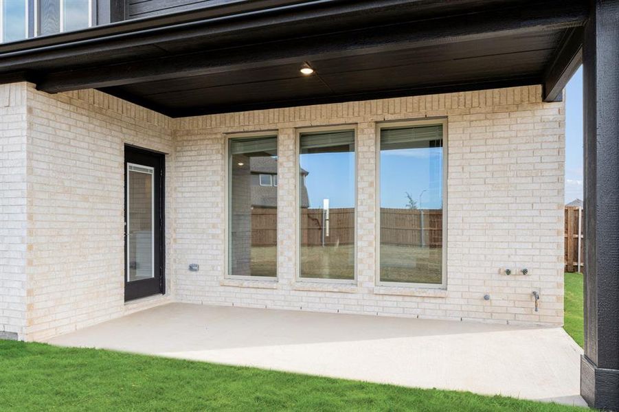 Exterior details and patio area of a home in Wildflower Ranch 60-65, Fort Worth (Image 4).