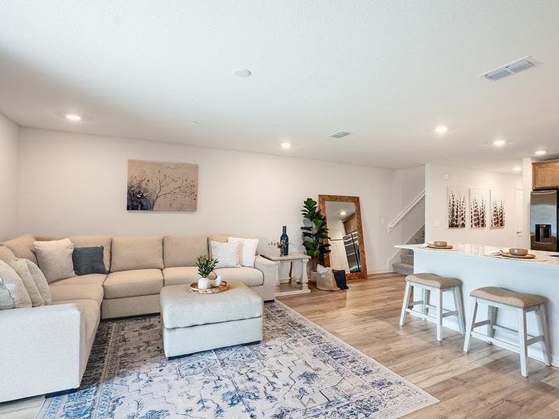 Enjoy a sunny and open living area - Azalea townhome by Highland Homes