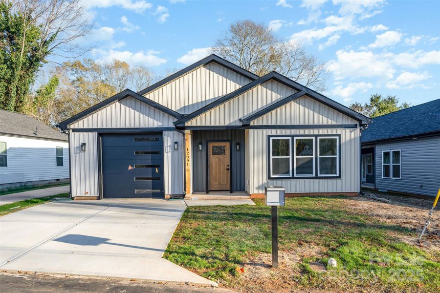 Front exterior of a new home in , Shelby, NC, highlighting curb appeal (Image 1).