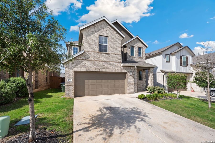 Front exterior of a new home in Veramendi, New Braunfels, TX, highlighting curb appeal (Image 23).