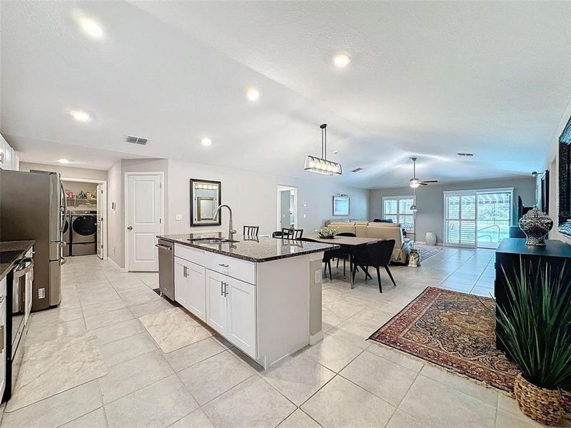 FULL LENGTH OF THE HOME IS OPEN AND BRIGHT
