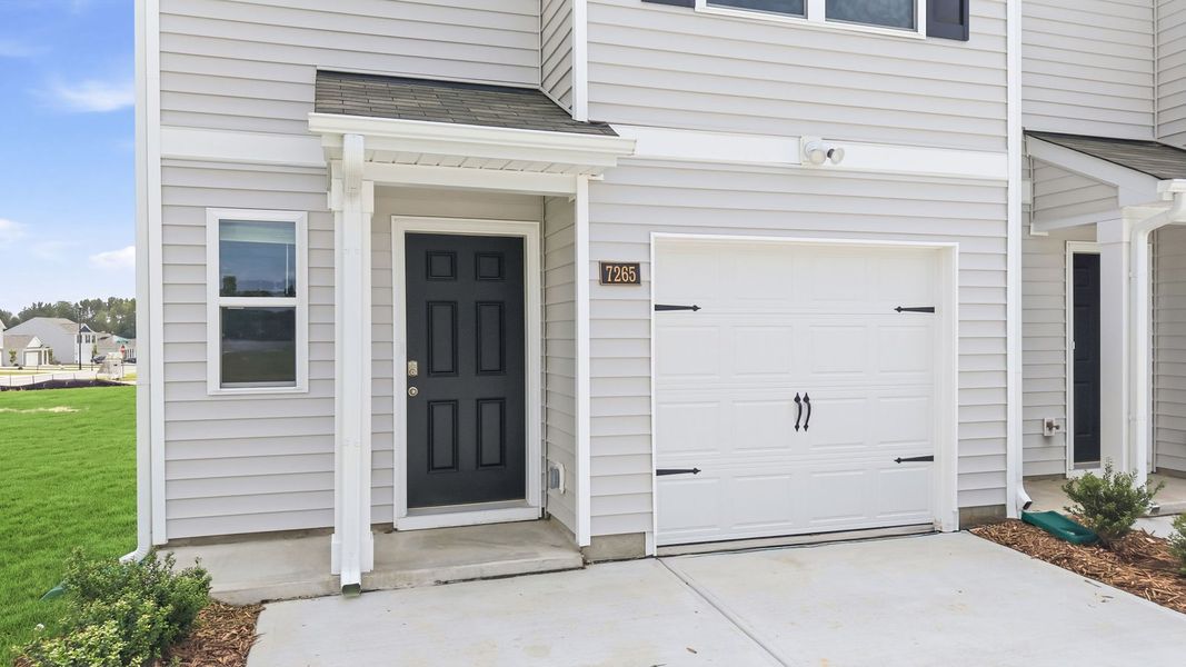 Exterior details and patio area of a home in The Townes at Hunter Hill, Rocky Mount (Image 3).