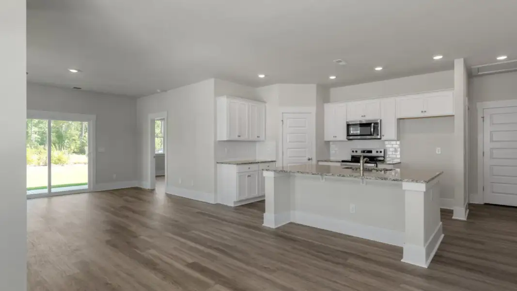 Furnished interior view inside a new home in The Retreat at Indigo Preserve Townhomes, Leland (Image 9).