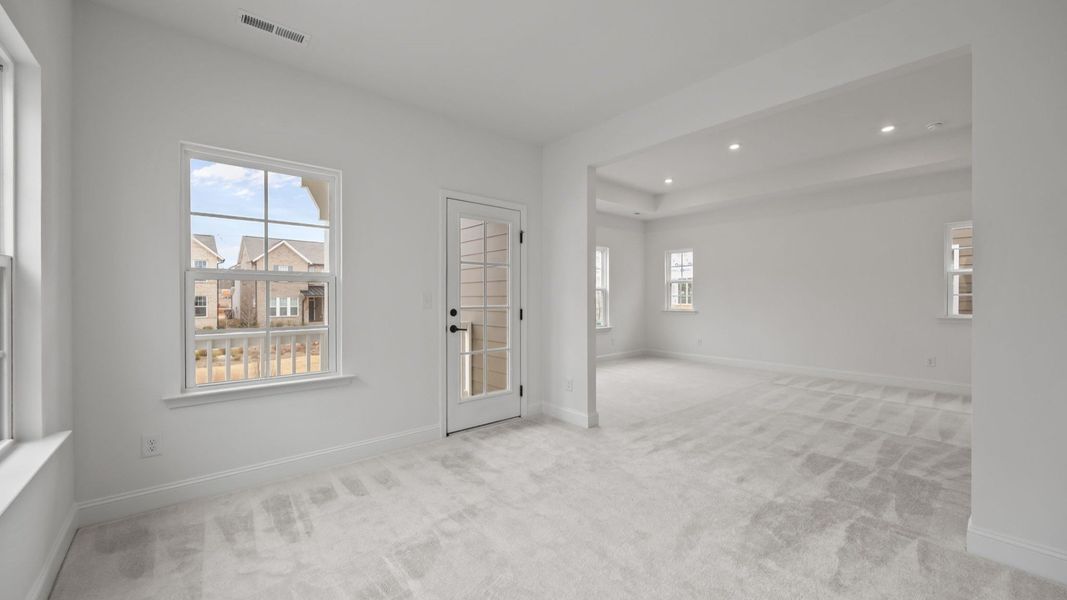 The Brentwood Plan by DRB Homes in River District, Charlotte NC.- Primary Bedroom with Sitting Area The Brentwood Plan by DRB Homes in River District, Charlotte NC.- Primary Bedroom with Sitting Area