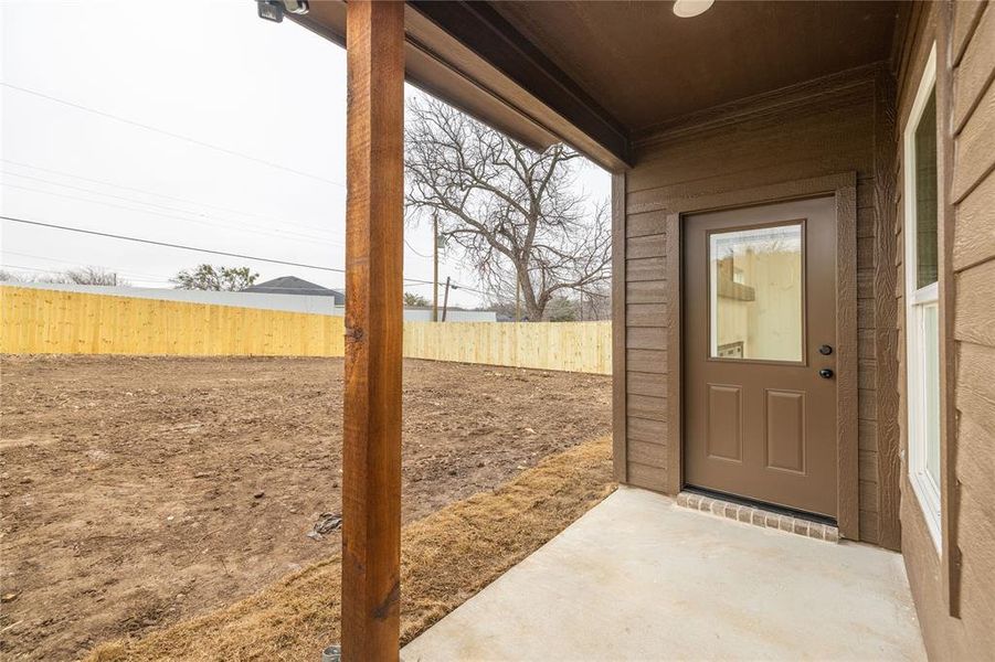 Property entrance featuring a patio