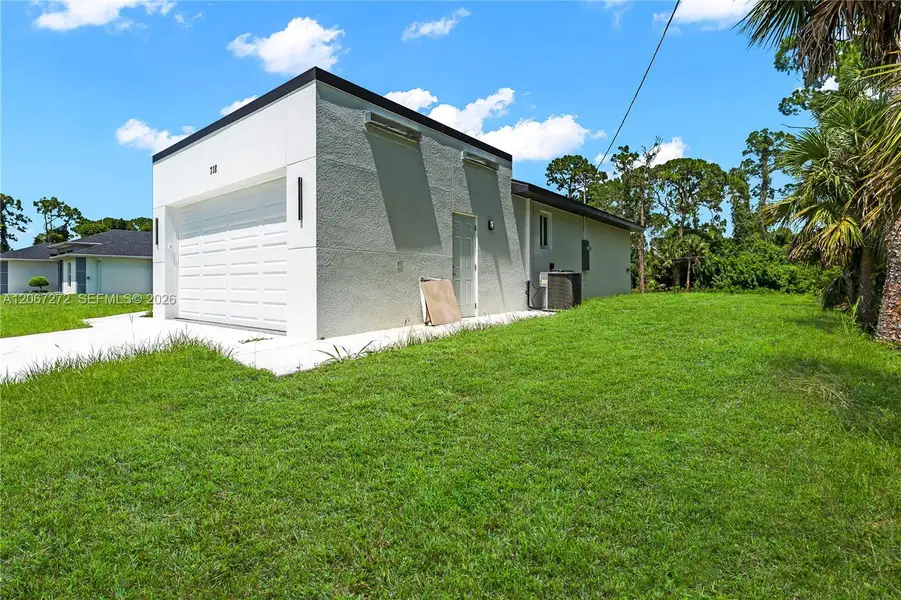 Exterior details and patio area of a home in , Lehigh Acres (Image 19). Exterior details and patio area of a home in , Lehigh Acres (Image 19).