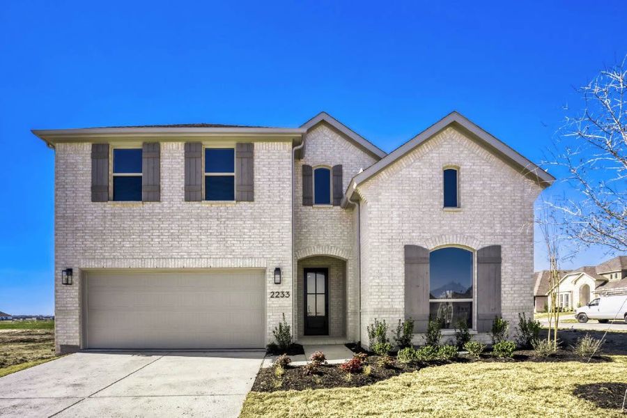 Front exterior of a new home in Meraki, Forney, TX, highlighting curb appeal (Image 2). Front exterior of a new home in Meraki, Forney, TX, highlighting curb appeal (Image 2).