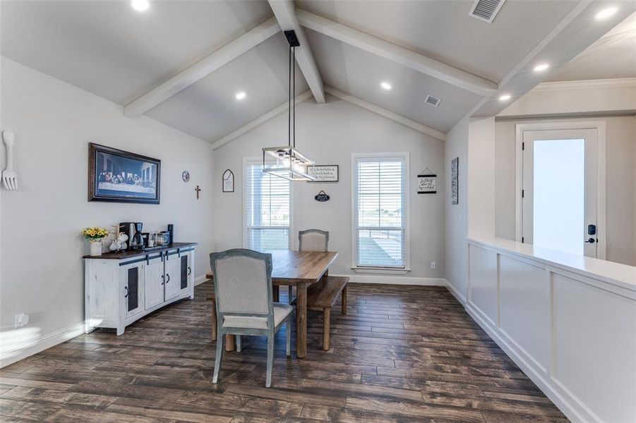 Dining space with recessed lighting and dark wood-style flooring