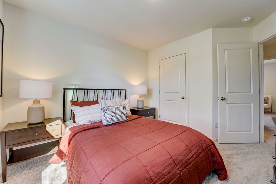 A bedroom with a bed and lamps. A bedroom with a bed and lamps.