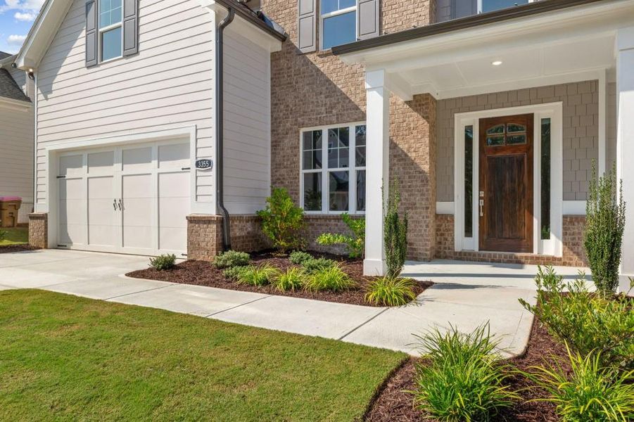 Front exterior of a new home in Hillshire, Cumming, GA, highlighting curb appeal (Image 2).